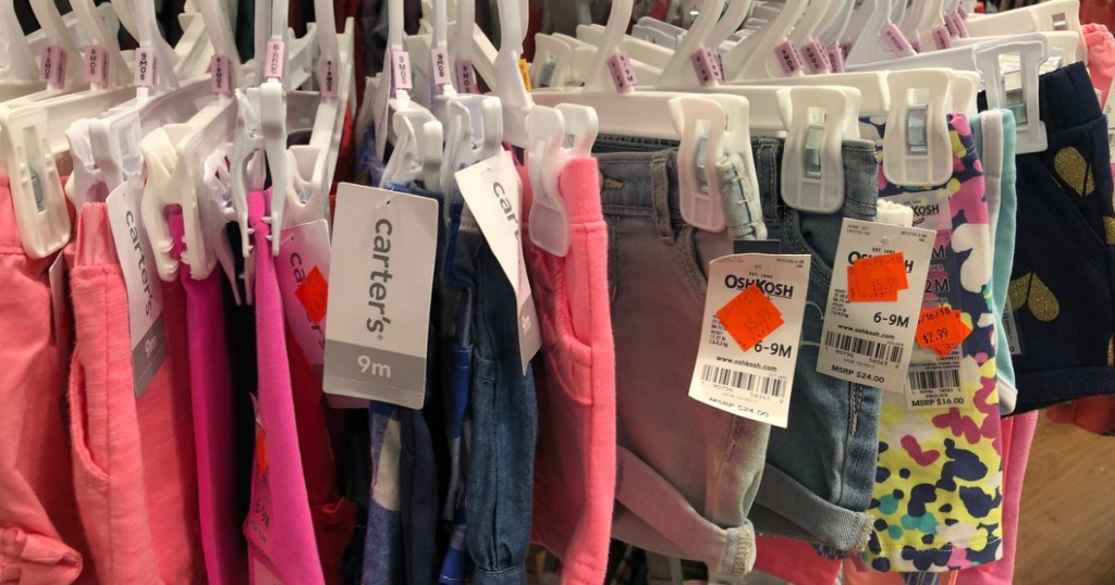 shorts hanging on store rack with tags showing