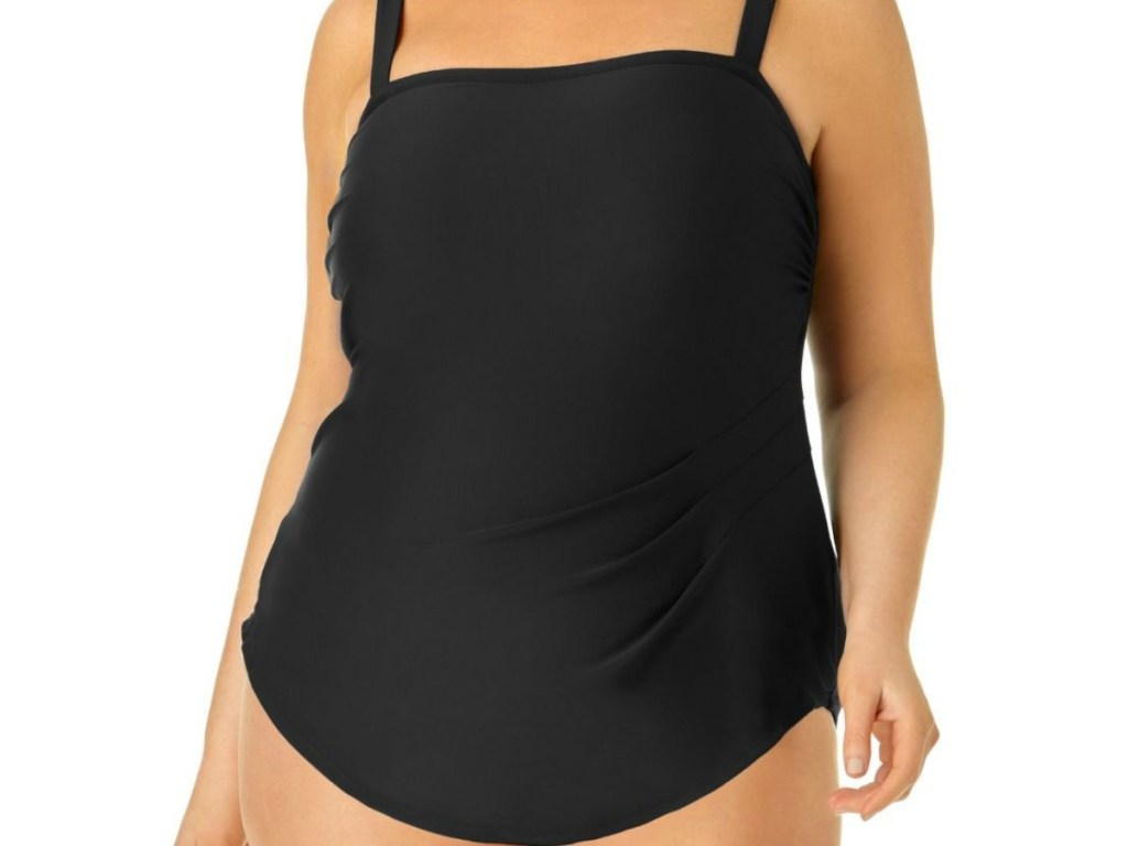 woman modeling black swim dress
