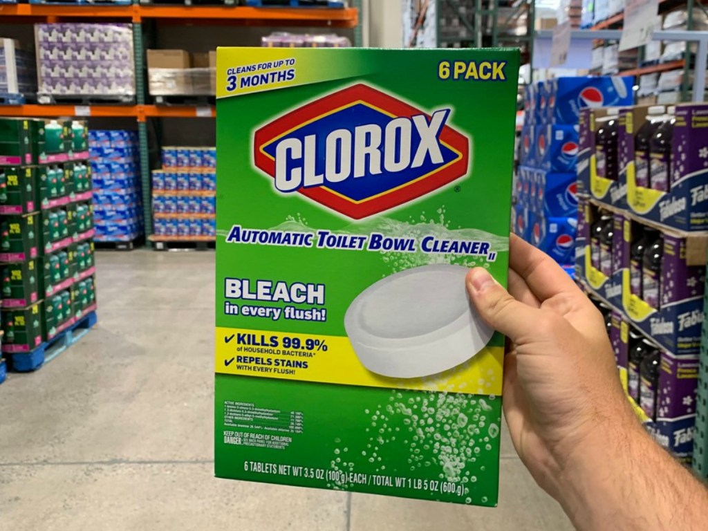 hand holding box of toilet bowl cleaner in store