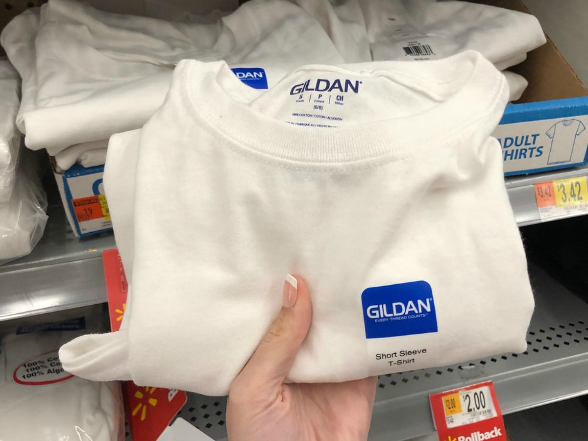 kids white t-shirt being held at Walmart