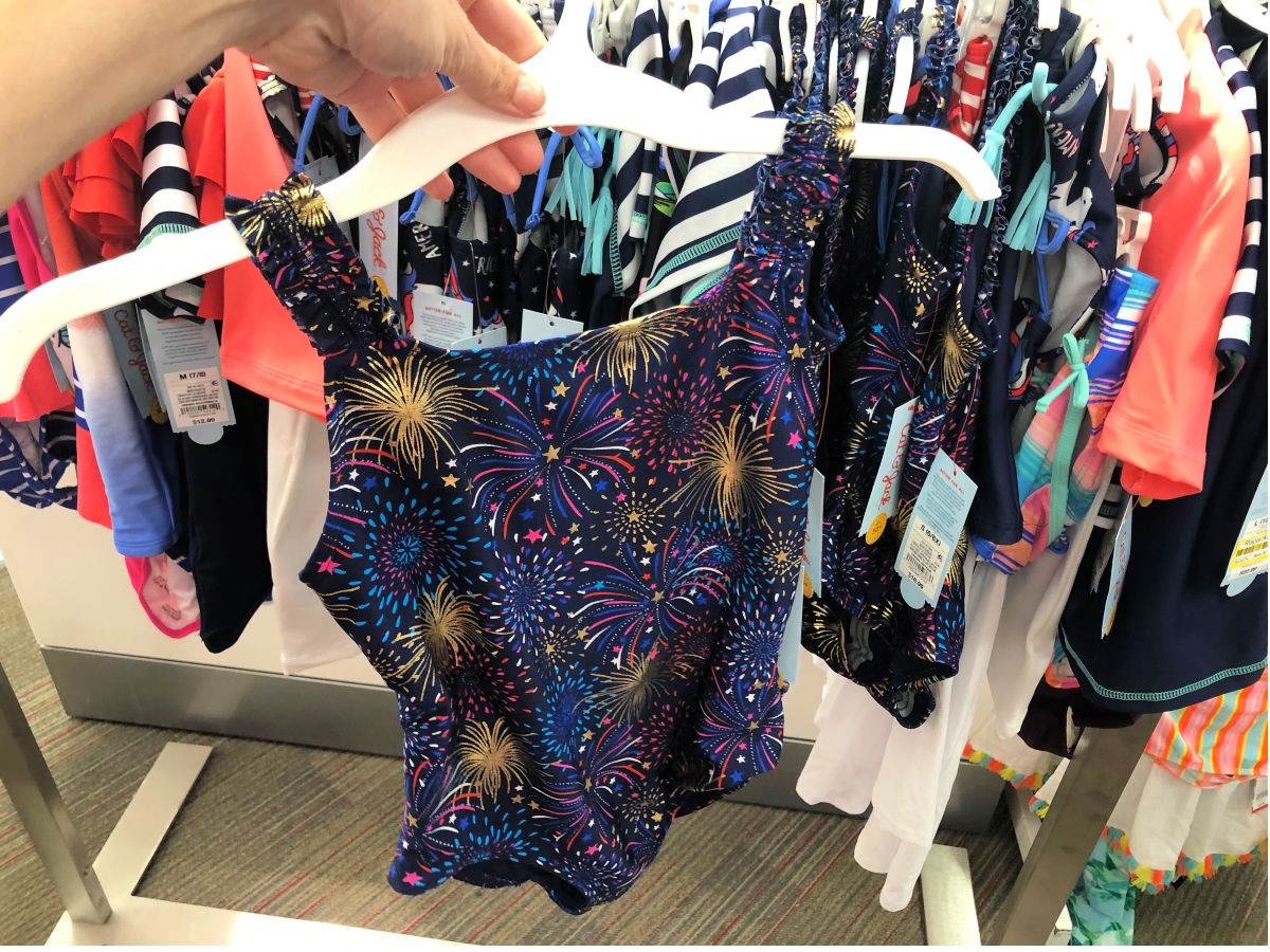 woman hand holding girls firework swimsuit at target