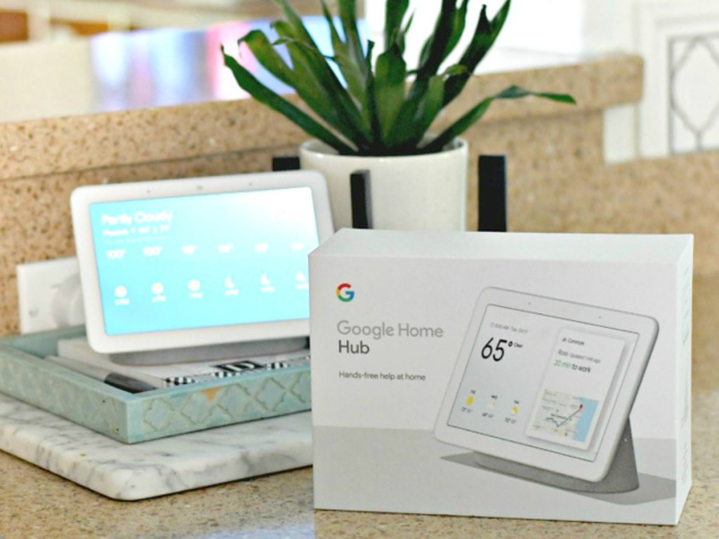 google home hub on the counter with the box