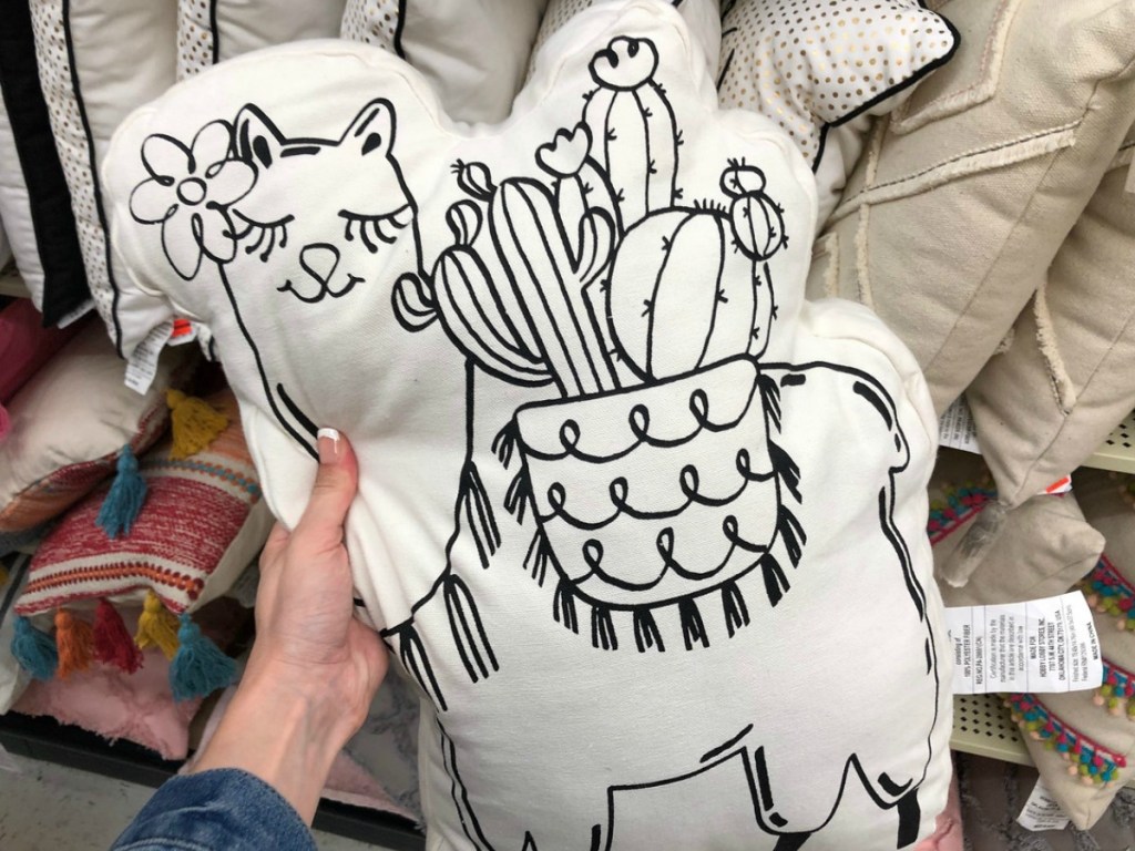 white llama shaped throw pillow with cactus on its back