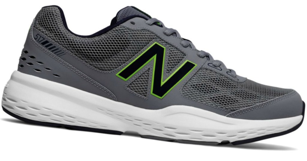 gray new balance shoe with black and green N