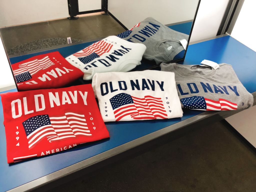 red, white, and grey old navy shirts in dressing room