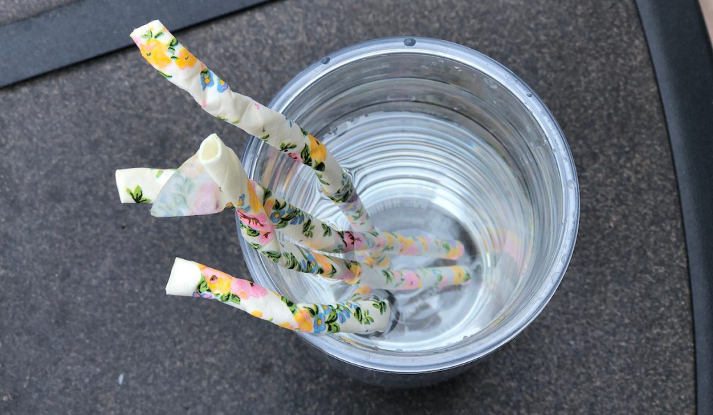 soggy floral paper straws in cup of water