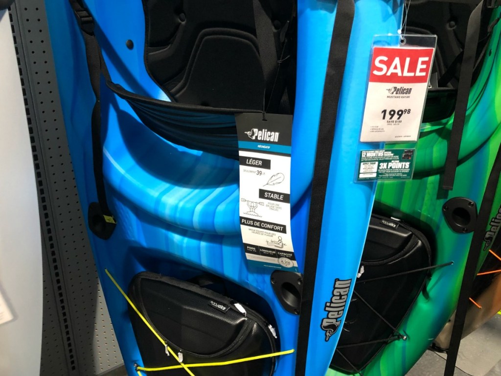 blue kayak with price tag in store