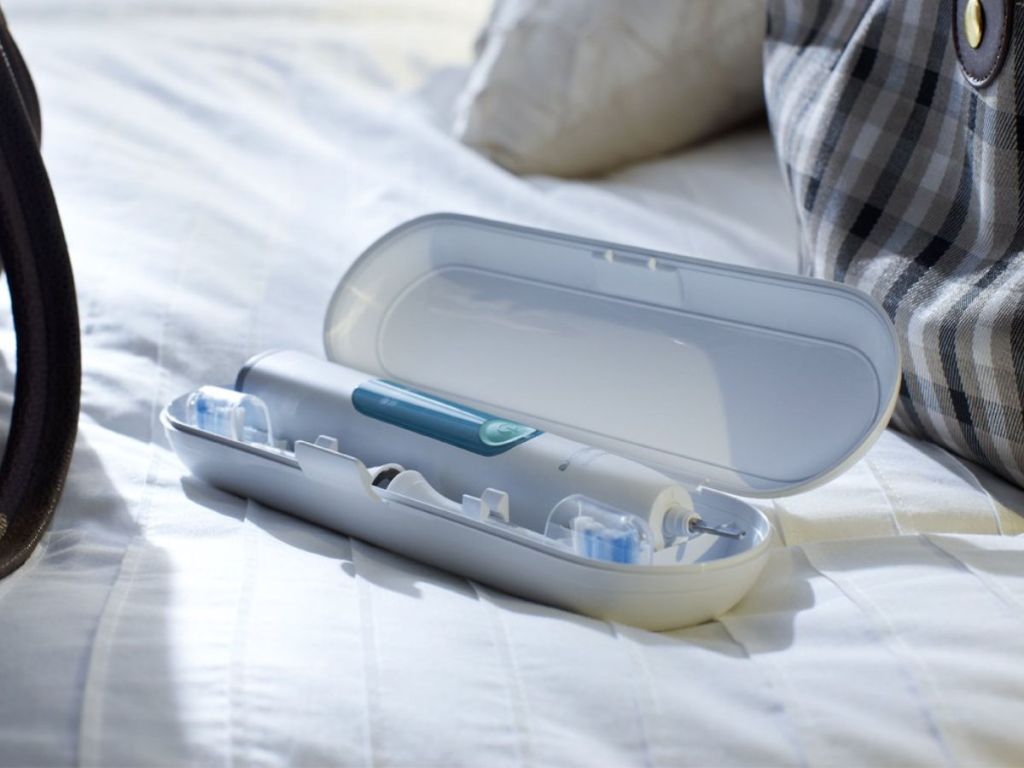 philips sonicare 3 in travel case on bed