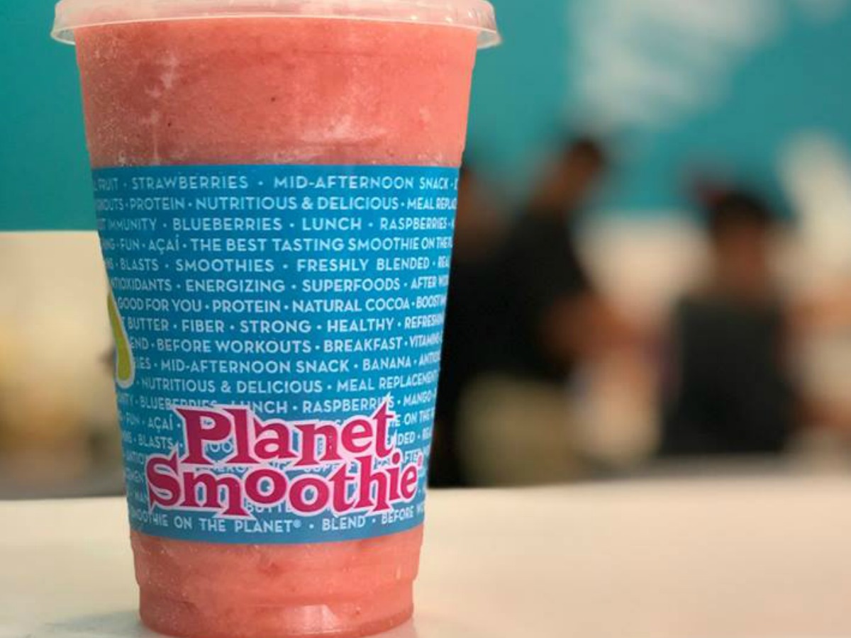 pink smoothie in cup which is free birthday stuff from planet smoothie