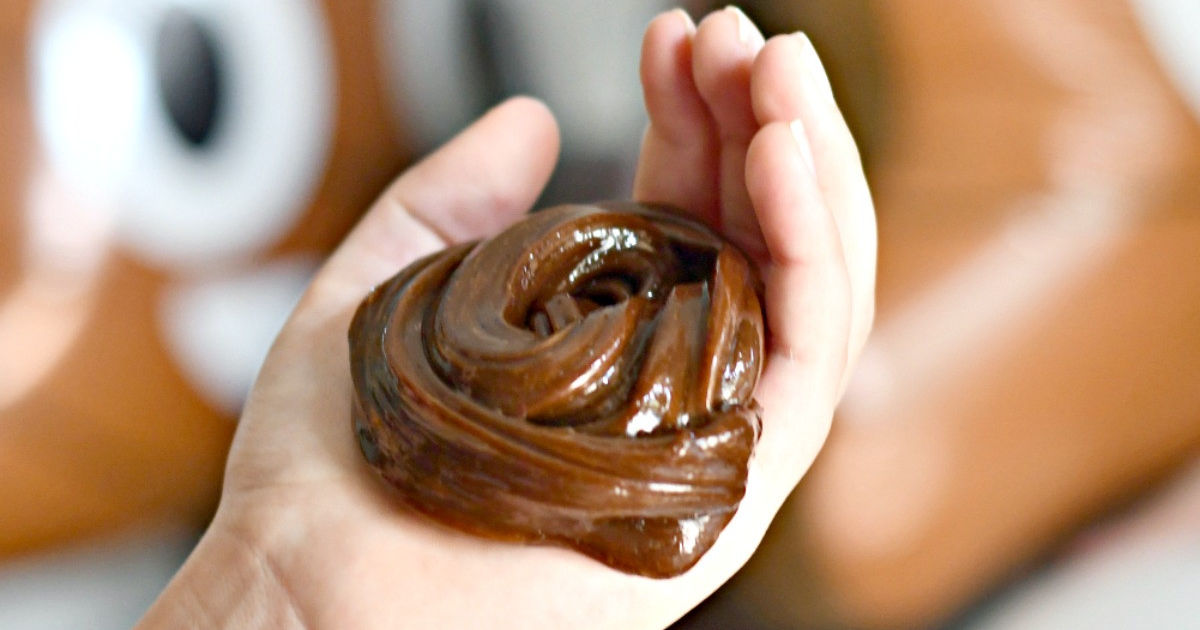 holding chocolate poop party slime