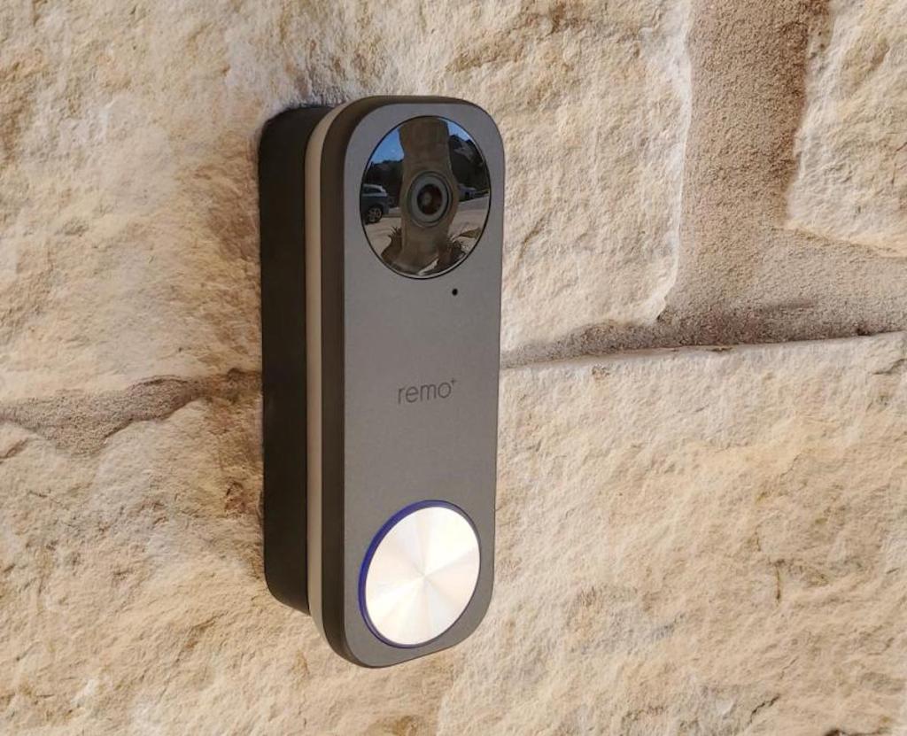 charcoal gray remo doorbell on tan colored brick
