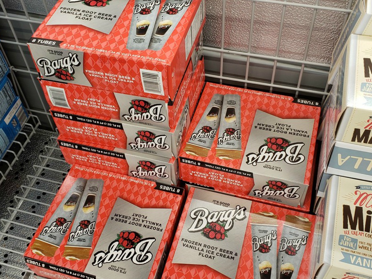 boxes of Barq's frozen root beer tubes in a store freezer case