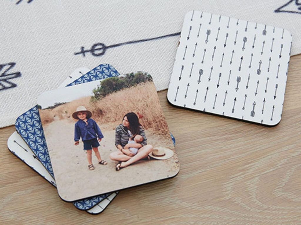 shutterfly coasters or woman holding a baby and young boy standing in the sand