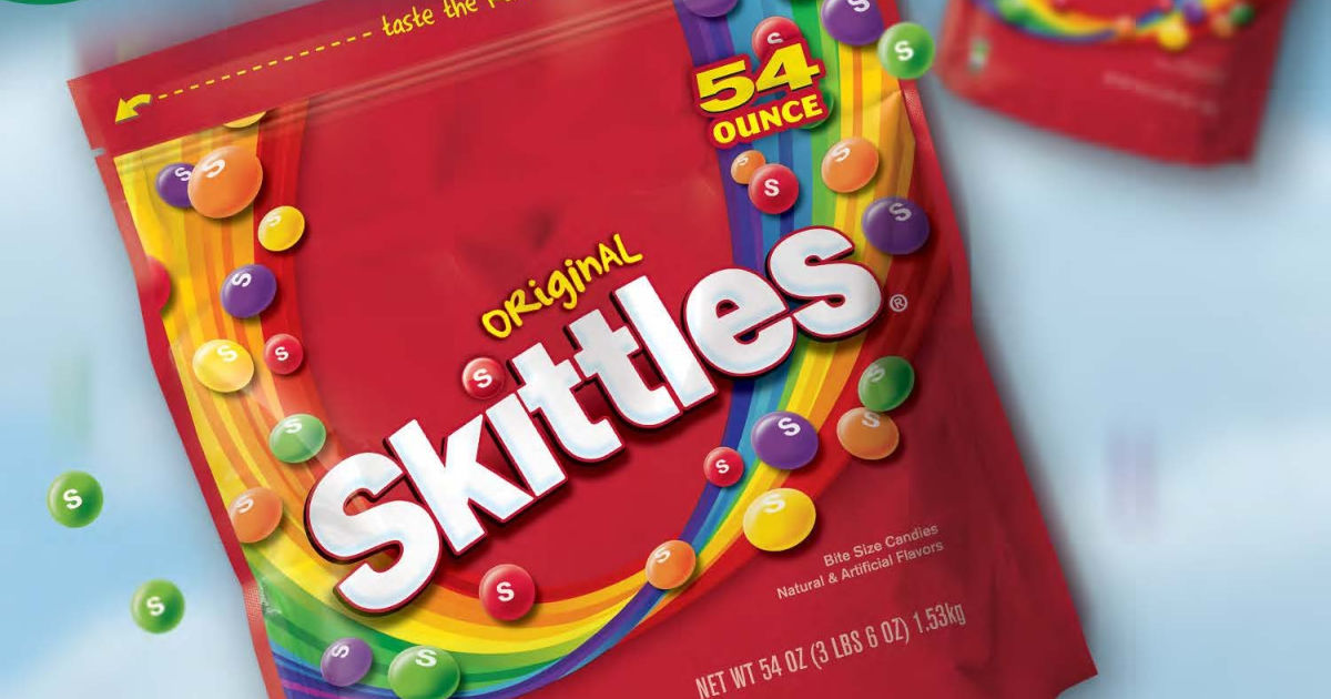 big bag of skittles falling from the sky with raining skittles