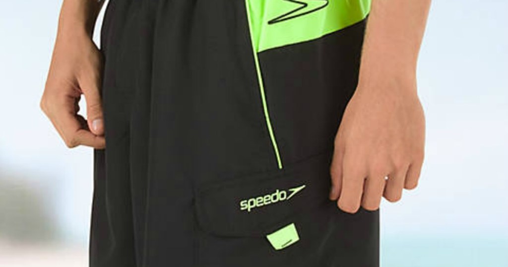man in black and green speedo suit