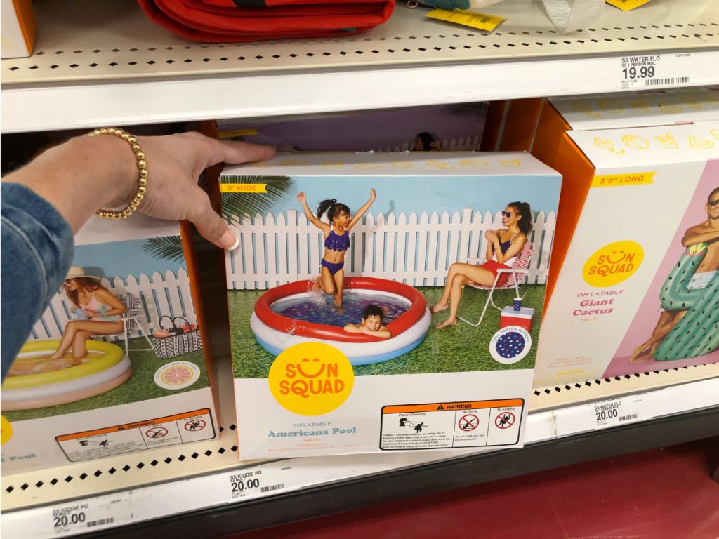 Woman holding sun squad inflatable americana pool in target