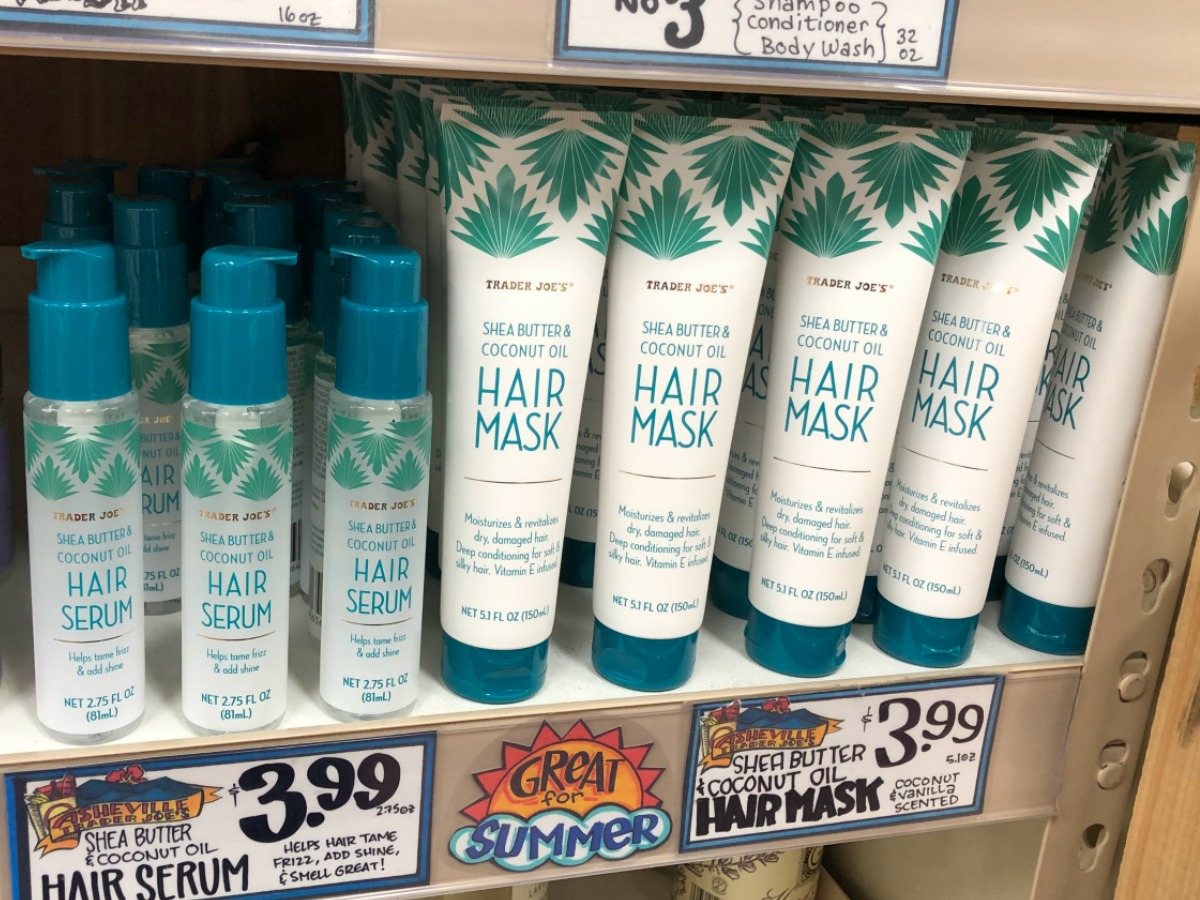 bottles of hair serum and hair masks on a Trader Joe's shelf with sale signs