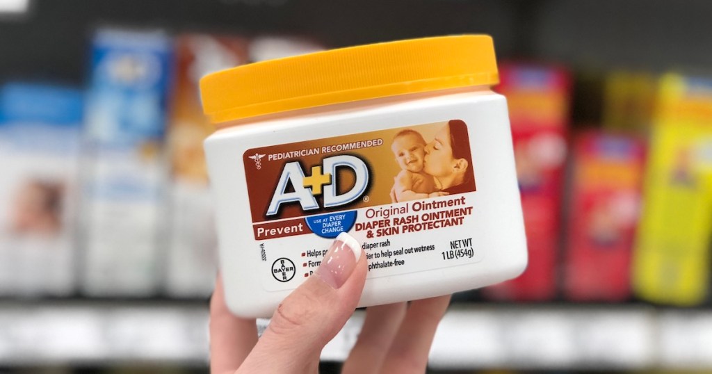 hand holding a+d ointment jar in store