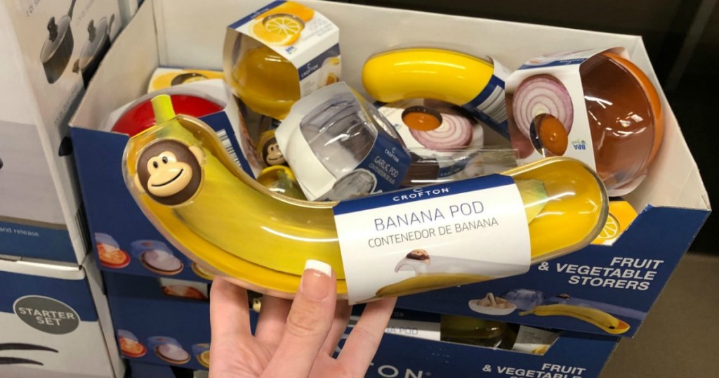 ALDI Banana Pod held up in front of ALDI shelf