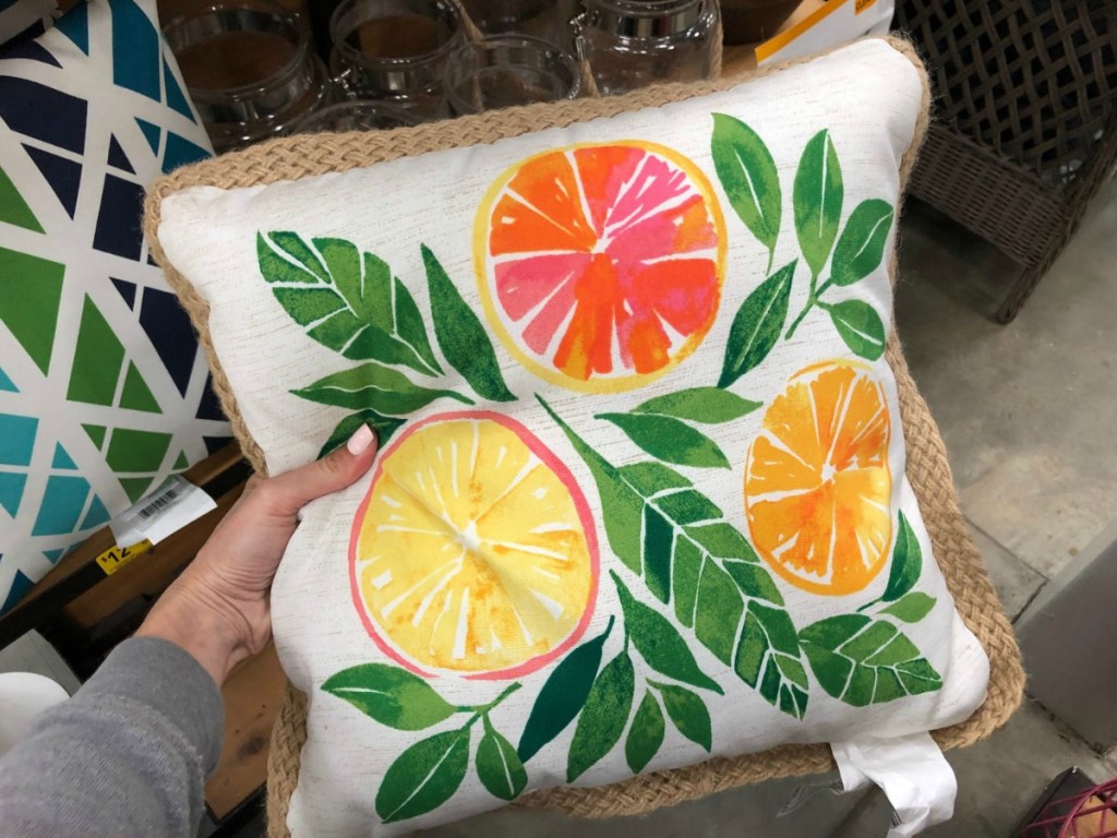 hand holding fruit pillow