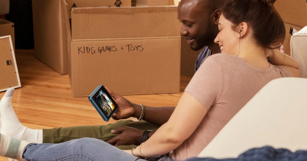 couple watching Amazon Fire tablet