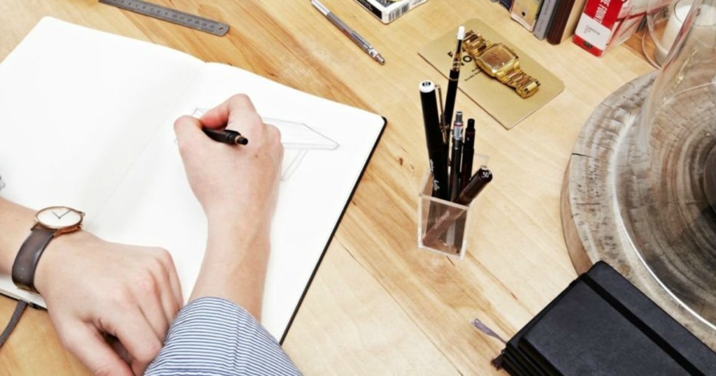 Man drawing with a mechanical pen