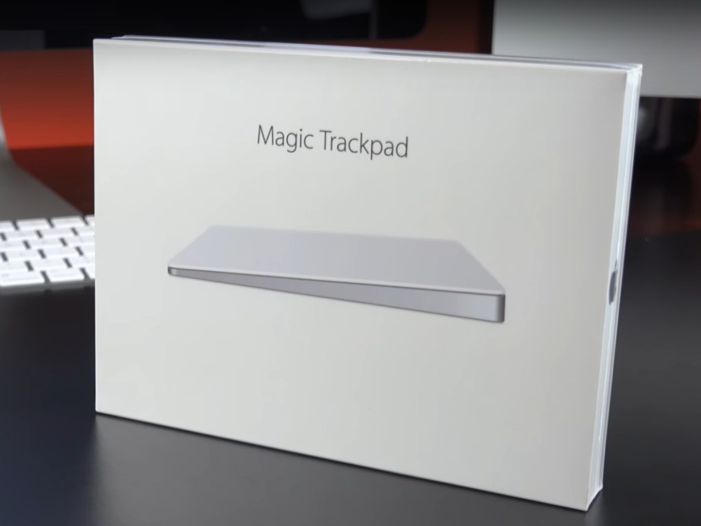 Apple Magic Trackpad 2 in retail packaging on desk