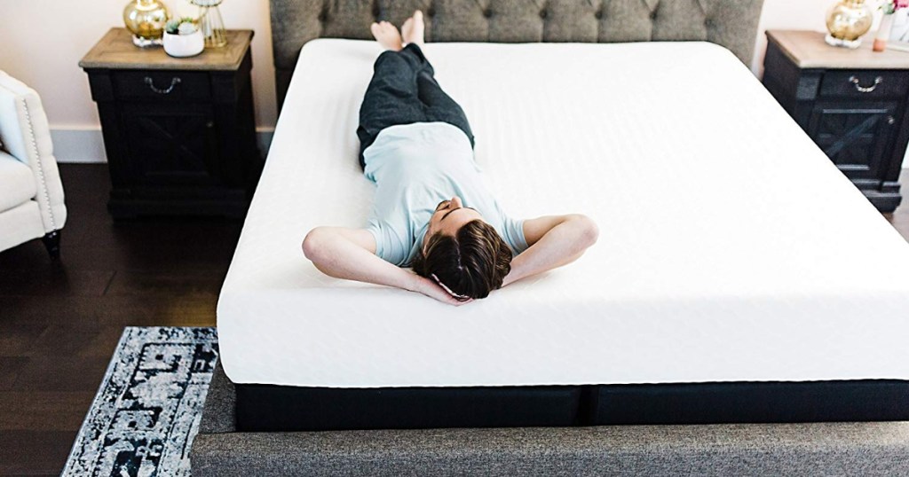 man laying on an ashley furniture queen mattress
