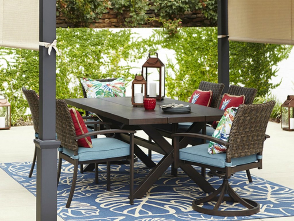 Atwood patio table with lanterns in outdoor setting