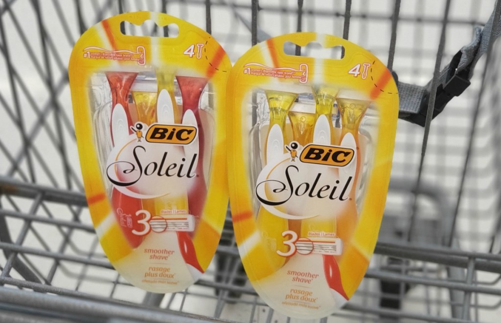 Twoo yellow packages of BIC disposable razors in cart at Walgreens