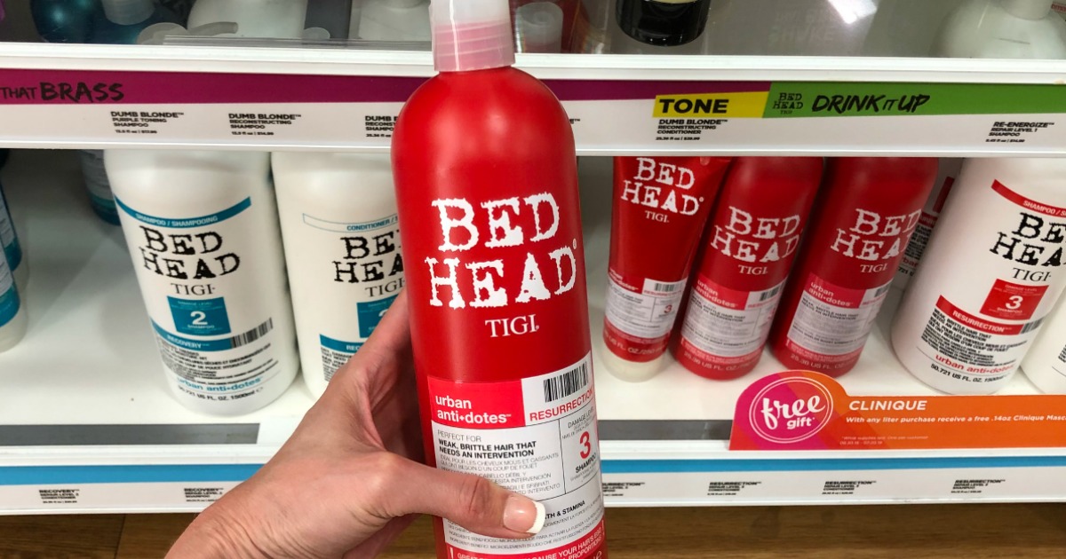 hand holding Bed Head shampoo