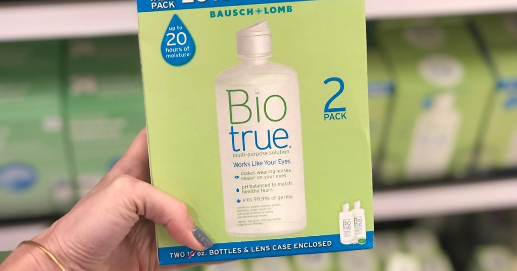 woman holding 2 pack of biotrue at store