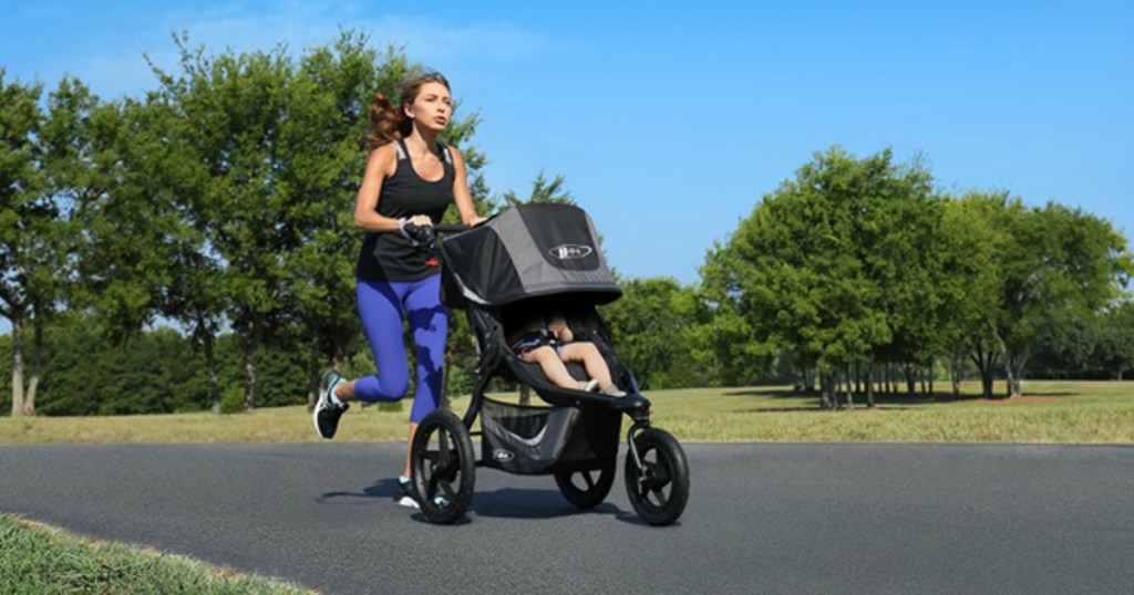 woman jogging while pushing stroller