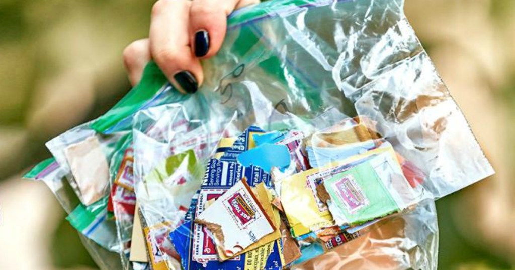 woman holding lots of Box Tops for Education in baggie
