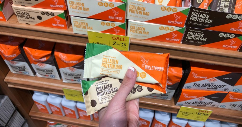 Woman holding Bulletproof Protein Bars in Whole Foods