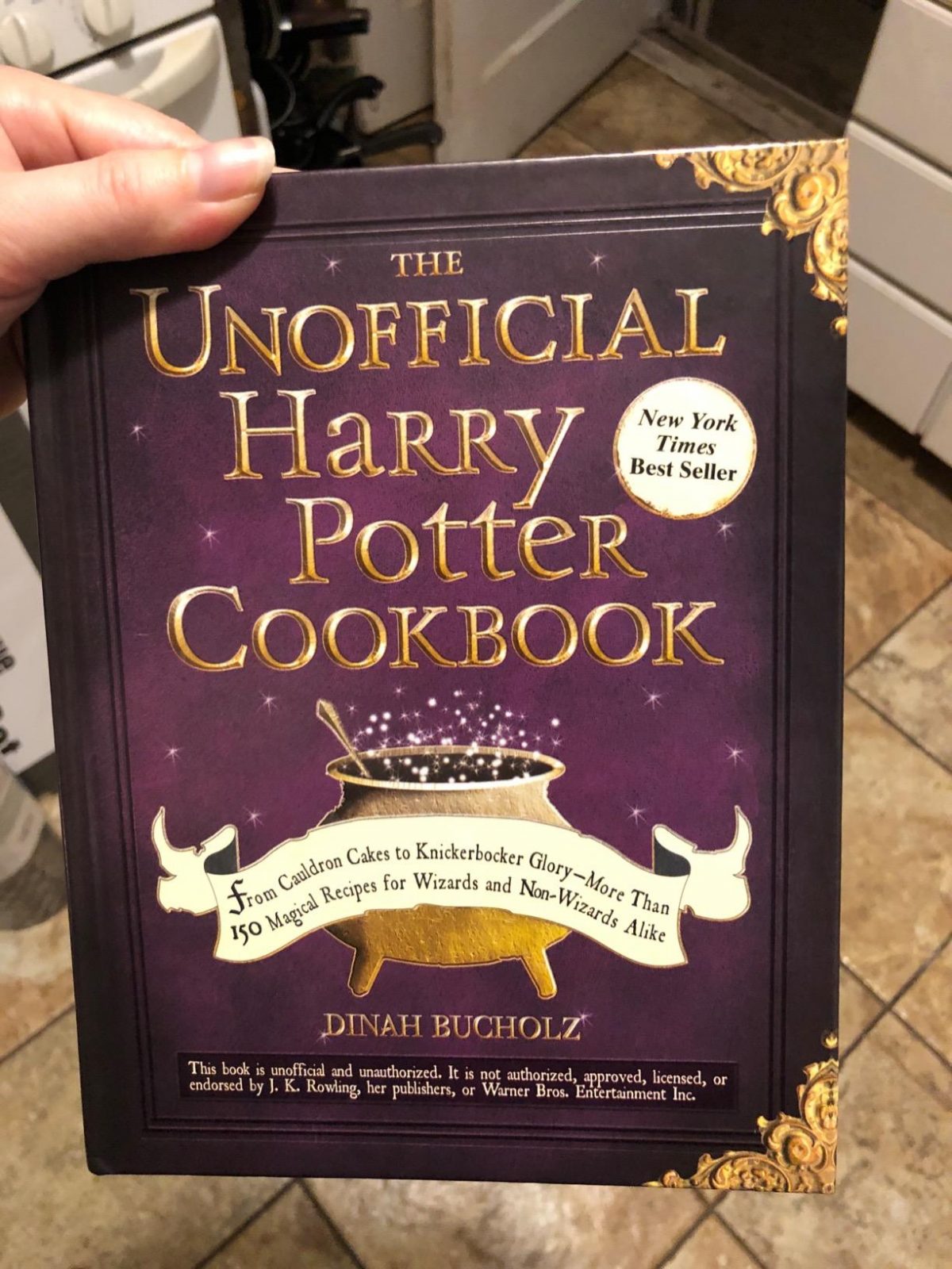 Woman holding The Unofficial Harry Potter Cookbook