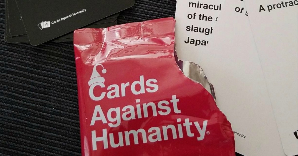 Cards Against Humanity Christmas Expansion Pack open with cards scattered