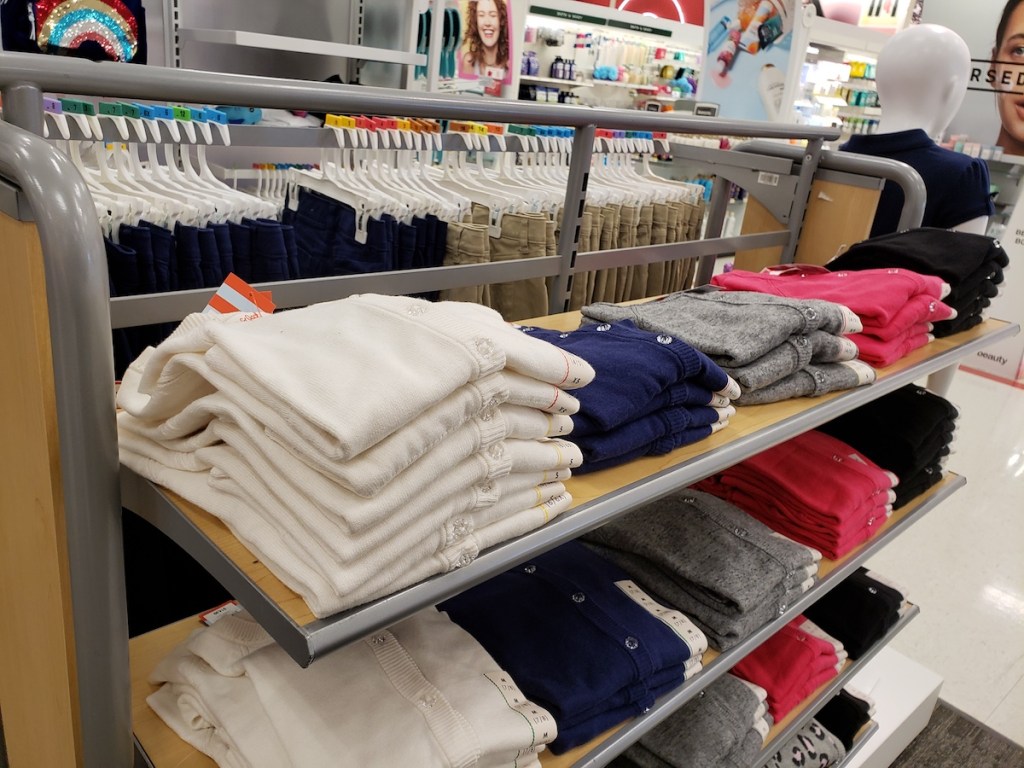 uniform sweaters on shelf at Target