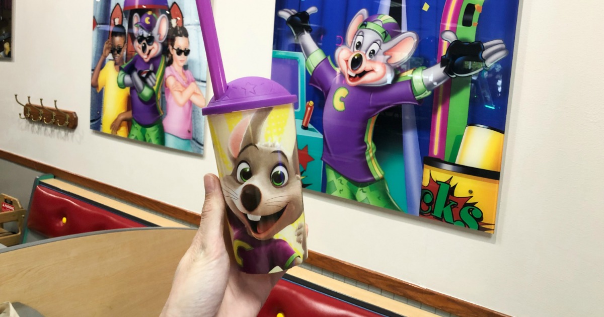 Woman holding Chuck E Cheese limited edition collectible cup