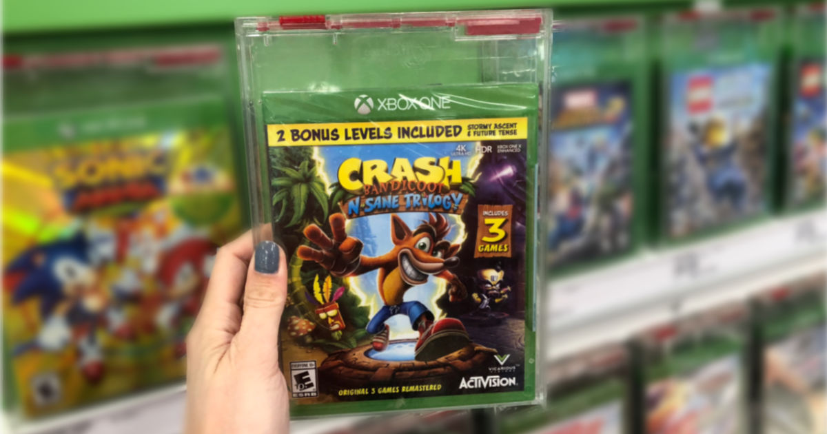 hand holding Crash Bandicoot N. Sane Trilogy Video Game in target