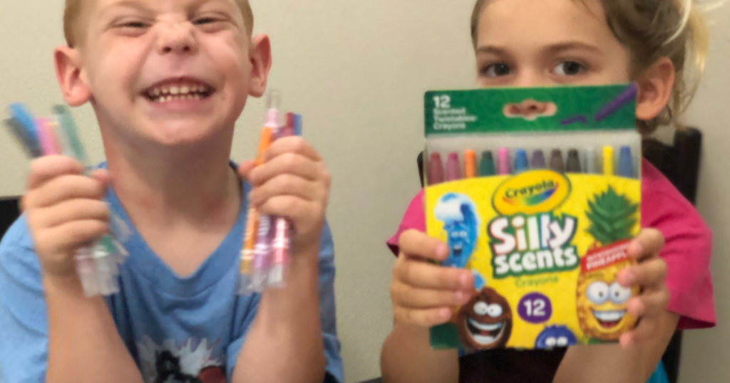 Crayola Silly Scents Twistable Crayons with kids holding them with excitement