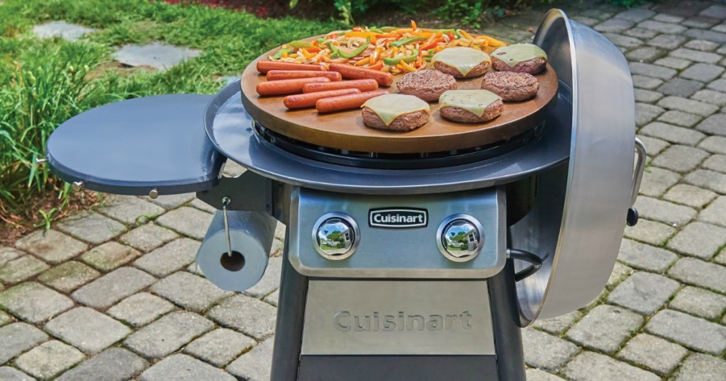 Cuisinart Griddle Cooking Center with hamburgers, hot dogs, peppers and onions on it