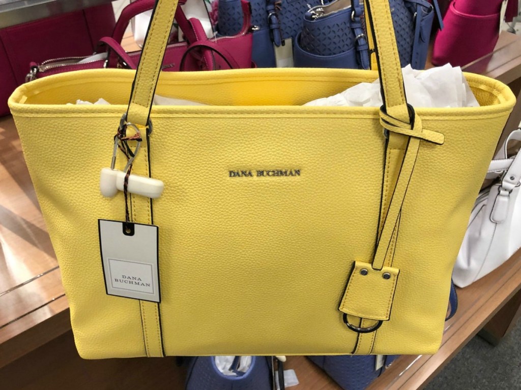 yellow purse hanging in store display