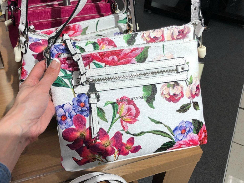 hand holding floral patterned post in store