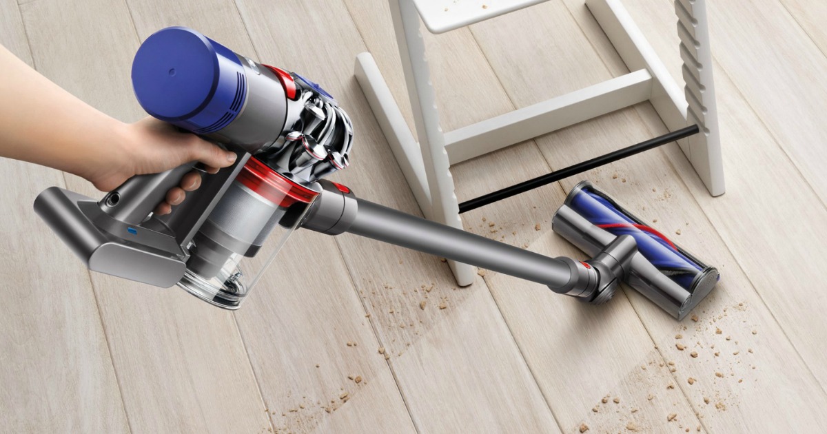 Dyson V7 Motorhead Extra Cordless Stick Vacuum Cleaner cleaning crumbs on wood floor