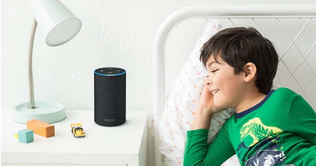 boy in bed looking at Echo 2nd Generation Smart Speaker with Alexa