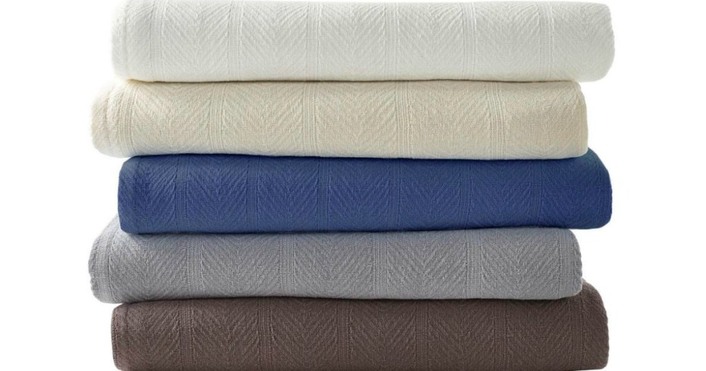 Stack of eddie Bauer cotton blankets in various natural colors