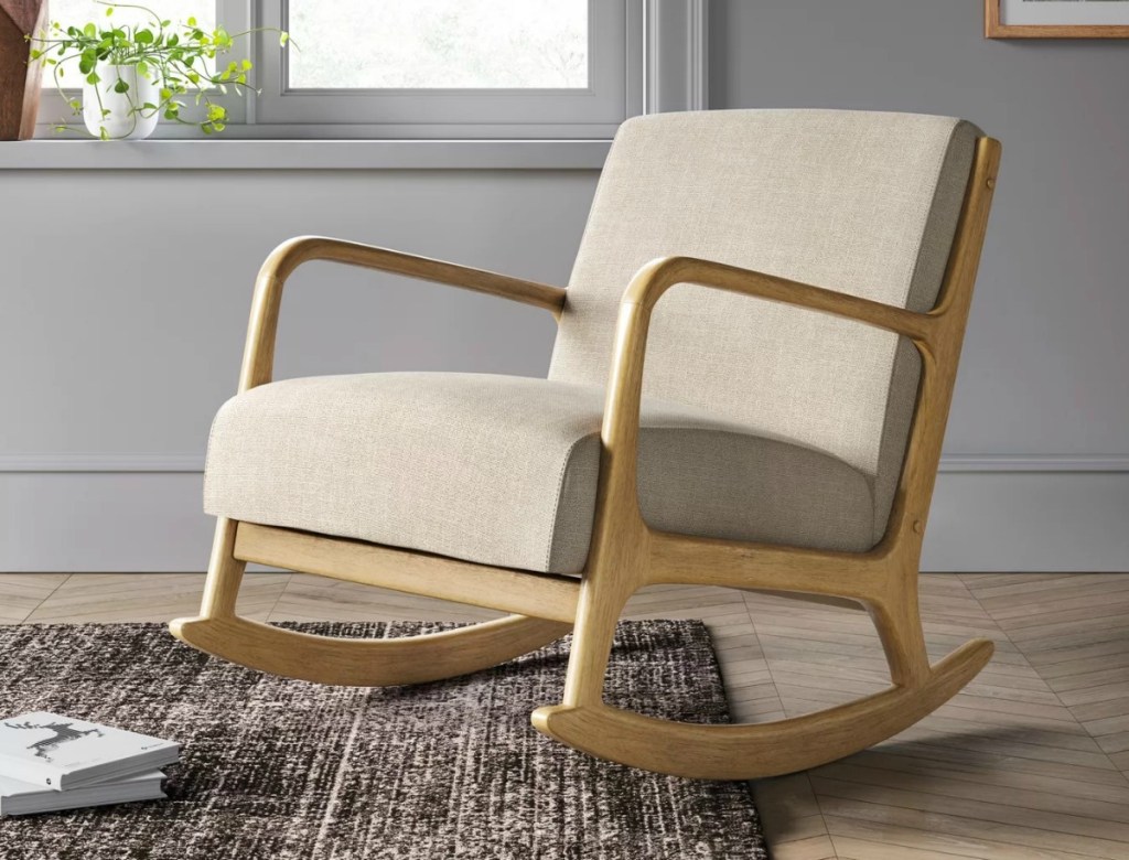 Beige rocking chair in living room on rug