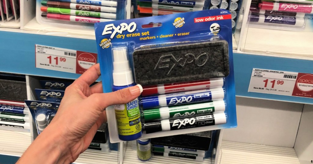 A hand holding a Expo Dry Erase Starter Set