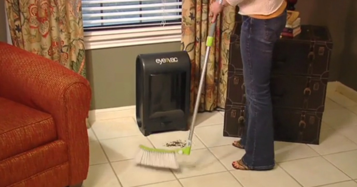 EyeVac Pro on tile floor with woman sweeping